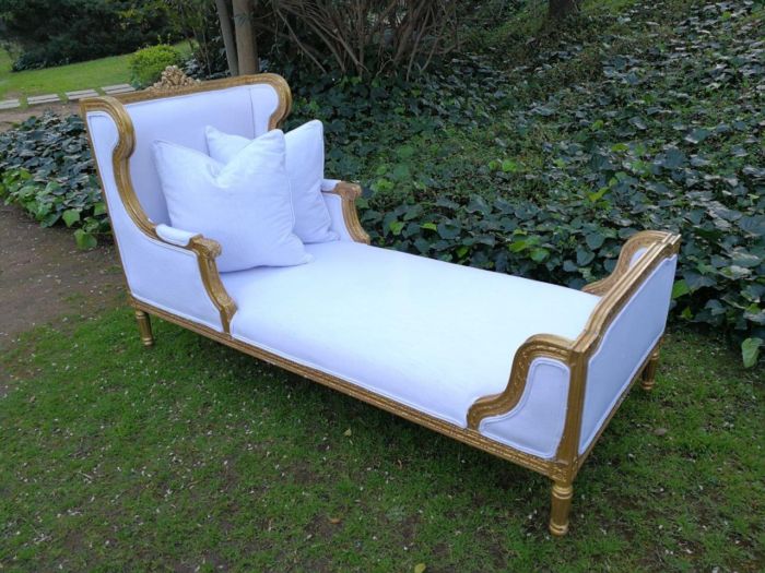 A Rare Carved and Gilded Daybed/Chaise in white *recently reupholstered*