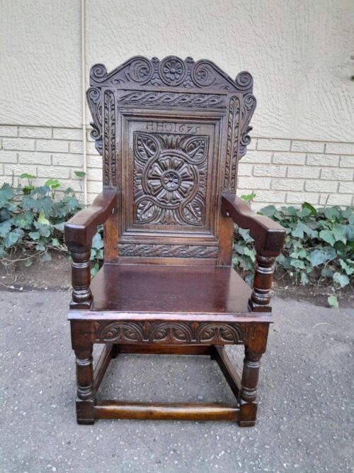 An 18th / 19th Century Carved Oak Wainscot Armchair the date and initials H. HO