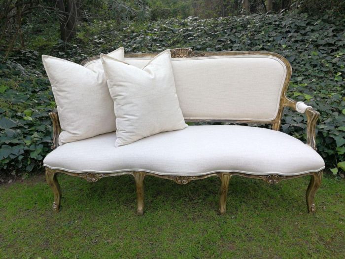 A 20th Century Carved And Hand-Gilded French Style Settee Upholstered In An Imported Linen