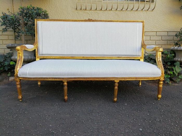 A 20th Century French Style Hand-Gilded Carved Settee