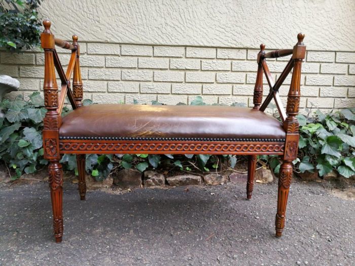 A 20th Century French Carved Mahogany Ottoman With Gilt Tooled Brown Leather