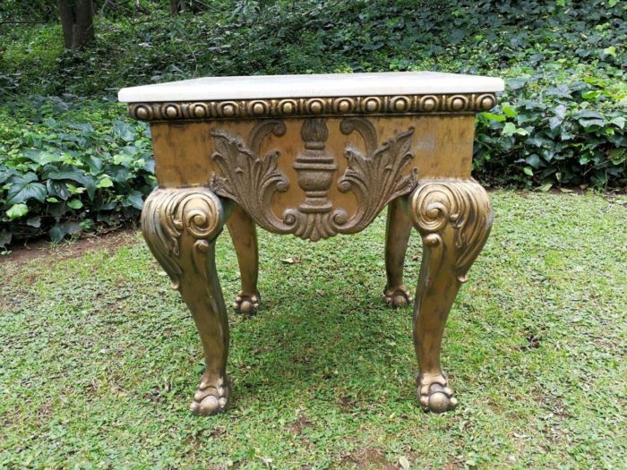 A Gilt Wood Coffee Table With Cream Marble Top