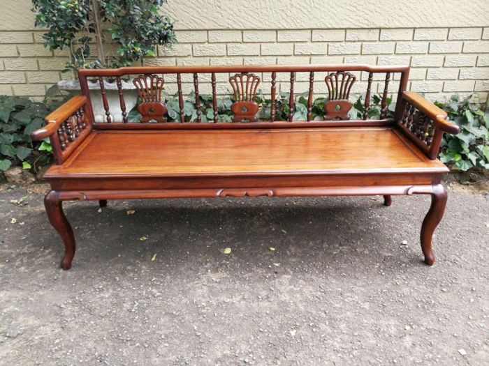 A 20th Century Ornately Carved Hardwood Bench