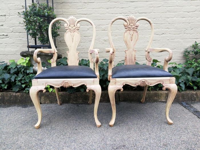 An Antique Pair of Bleached Walnut Carved Armchairs Upholstered in Leather