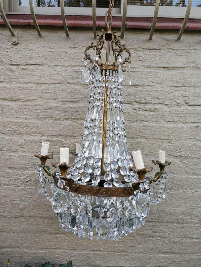 A 20th Century French Style Empire Brass and Crystal Chandelier