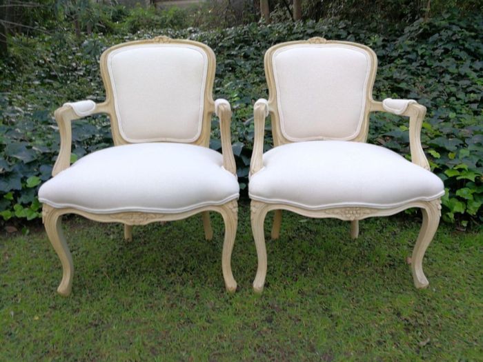 A Pair of 20th Century French Rococo Style Oak Armchairs in a bleached / natural finish