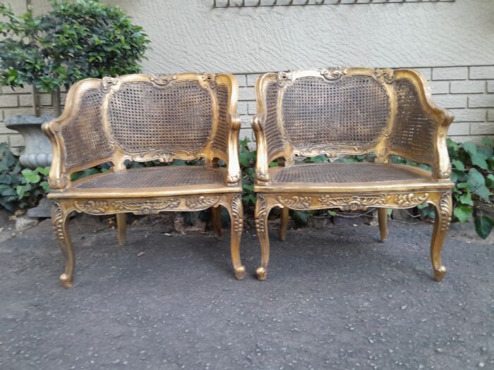 A 20th Century Pair or French Bergere Style Carved and Hand Gilded in Gold Leaf Wooden Chairs - Image 3