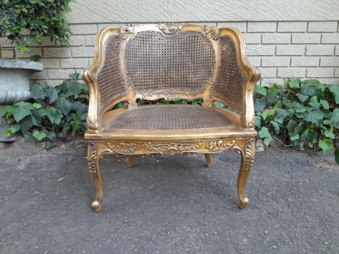 A 20th Century Pair or French Bergere Style Carved and Hand Gilded in Gold Leaf Wooden Chairs - Image 6