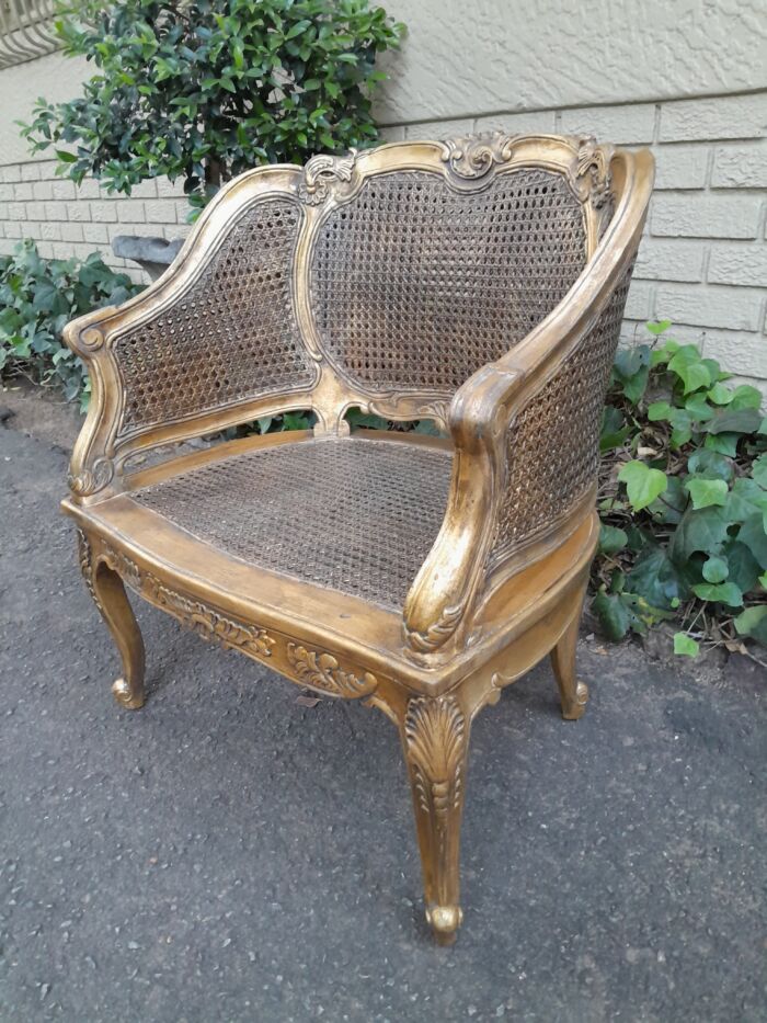 A 20th Century Pair or French Bergere Style Carved and Hand Gilded in Gold Leaf Wooden Chairs - Image 7