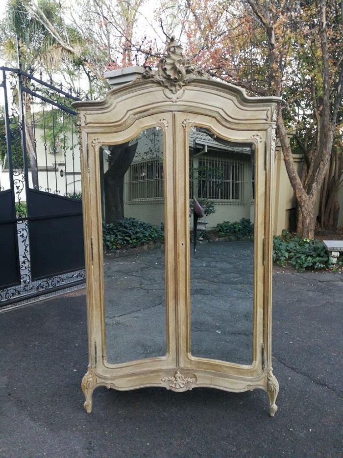 A 19th Century French Rococo Armoire In A Bleached Contemporary Finish With Bevelled Mirrors