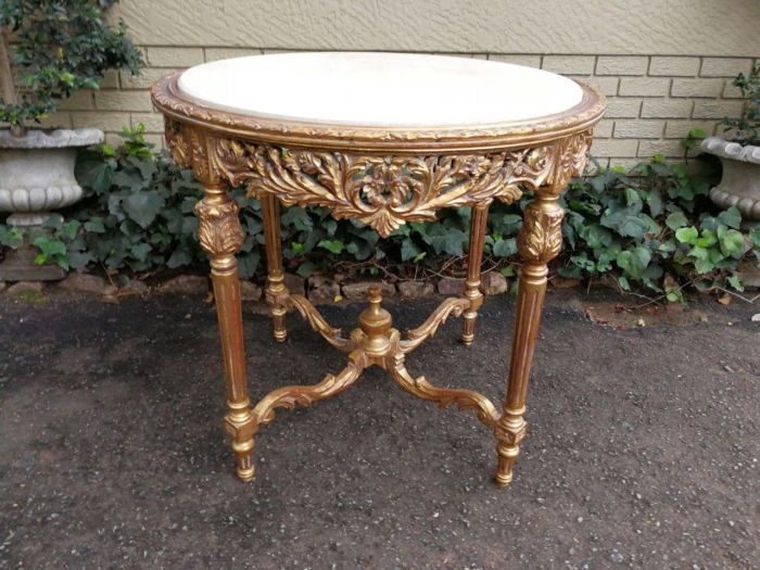 A French Style Ornately Carved Marble top Centre Table