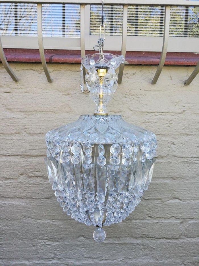 A French Style Brass and Crystal Plate Chandelier with Floral Top