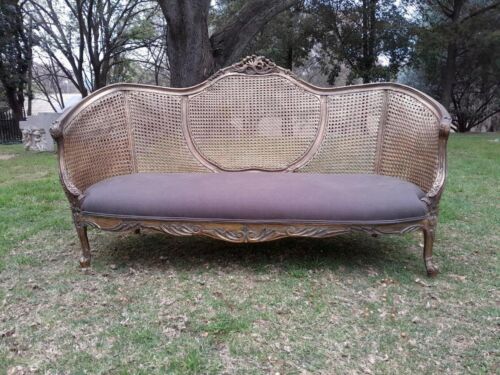 A Gilded Rattan Back Settee