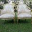 A Pair of French Louis XVI  Style Ornately Carved and Gilded Armchairs