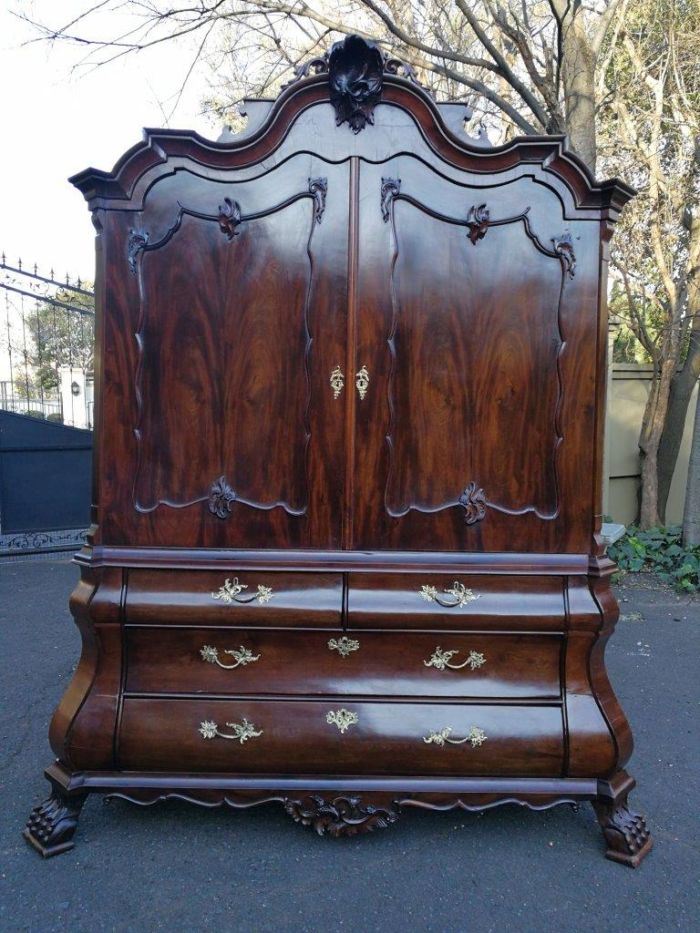 An 18th Century Circa 1770 Dutch Mahogany Armoire / Cabinet With The Original Glit Brass Rococo Handles And Lock And Key. The Middle Drawer Has Two Secret Sliding Locks To A Secret Panel Opening Four Secret Drawers