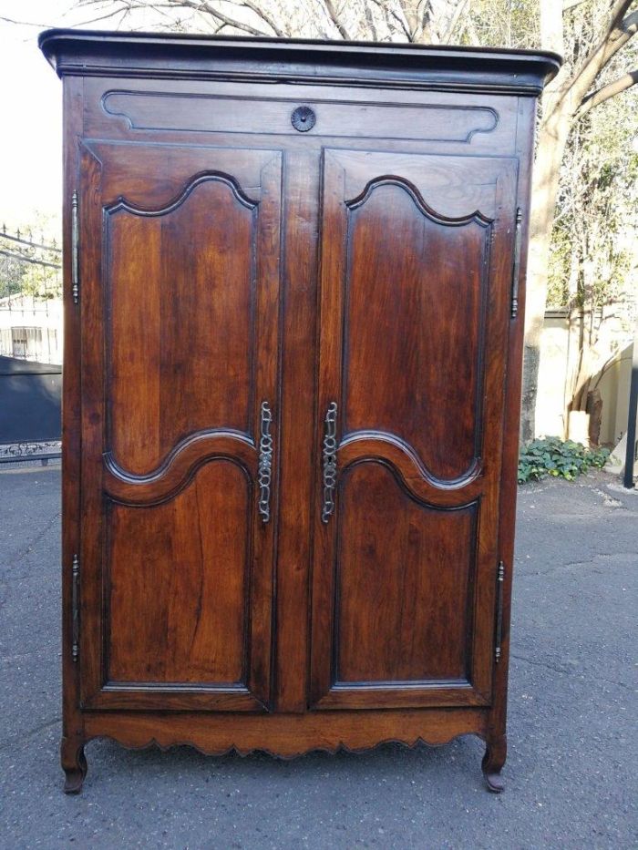 A Late 19th Century Circa 1890 French Oak Provincial Armoire With Metal Escutcheons