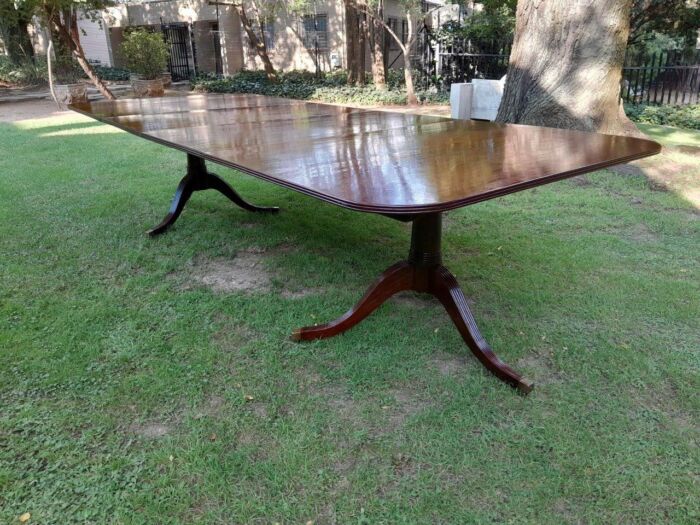 A 20th Century Regency-style Mahogany Extending Dining Table On Casters with Two Leaves and One Other - Image 4