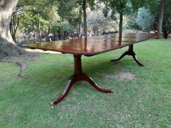 A 20th Century Regency-style Mahogany Extending Dining Table On Casters with Two Leaves and One Other - Image 5