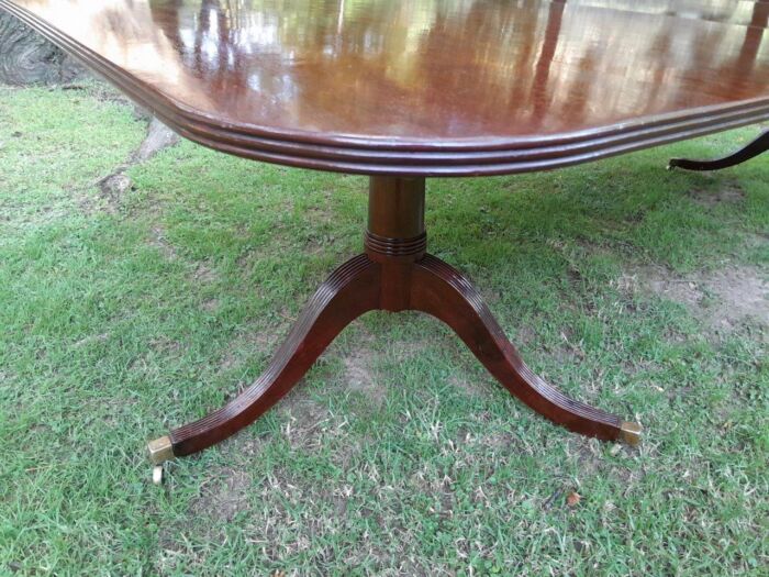 A 20th Century Regency-style Mahogany Extending Dining Table On Casters with Two Leaves and One Other - Image 6