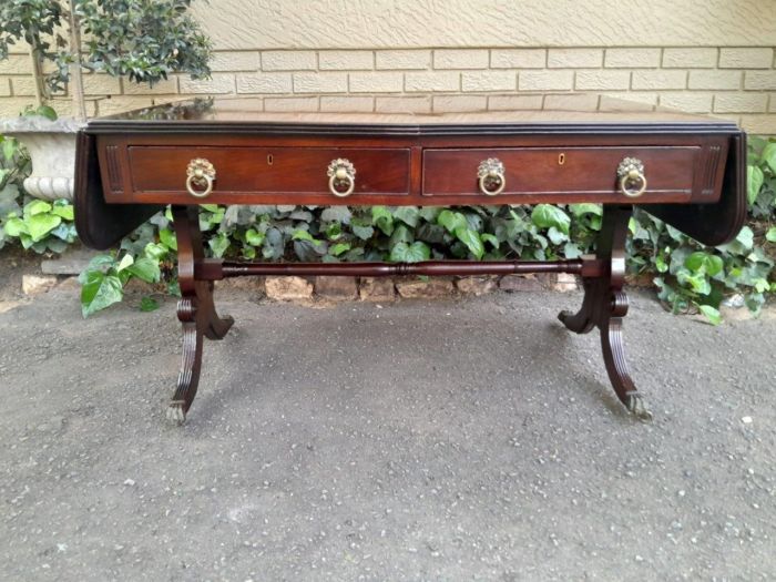 A Victorian Circa 1870, Mahogany Drop-side Library Table, With Drawers and Brass Escurcheons (the opposite reverse fitted with conforming dummy drawers) With Brass Paw Feet - Image 5