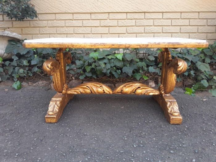 A 20th Century Carved and Giltwood Table with Marble Top