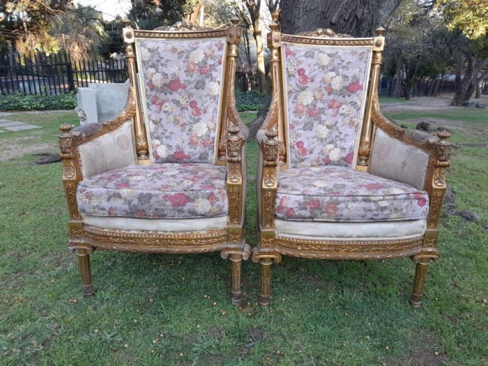 A 20th Century Pair of French Style Bergere Hand Gilded Wooden Armchairs