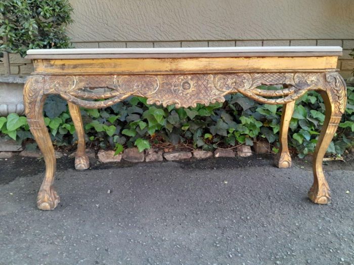 A 20th Century Ornately Carved Server/ Console/Entrance Hall Table with a Marble Top