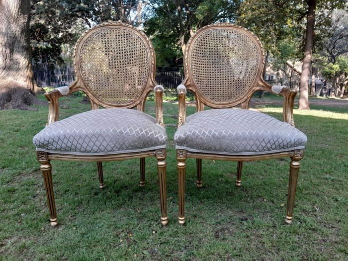 A Pair of 20th Century French Style Rattan-Back Gilded Arm Chairs