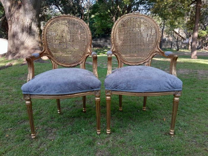 A Pair of 20th Century French Style Rattan-Back Gilded Arm Chairs