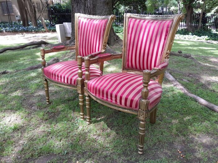 A Pair Of 20th Century French Louis XVI Styled Ornately Carved And Gilded Arm Chairs - Image 7