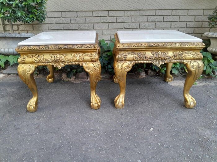 A Pair of 20th Century French Style Ornately Carved Hand Gilded Side Tables with Marble Top