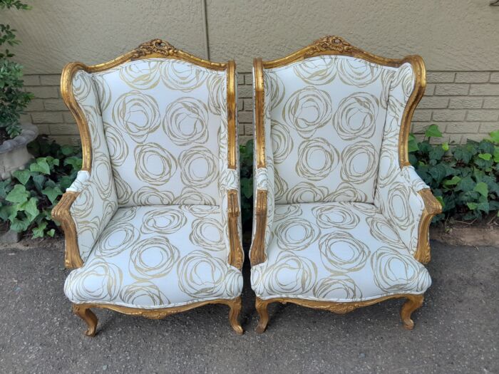 A French Style Pair of Hand Gilded Carved Wingback Chairs Upholstered in a Custom Made for The Crown Collection Cotton / Linen Fabric - Image 3