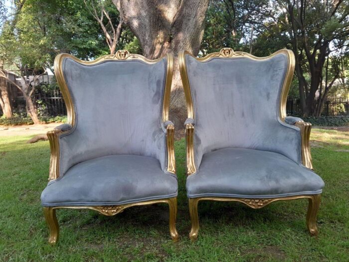 A Pair Of French Style Carved Wooden Wingback Armchairs