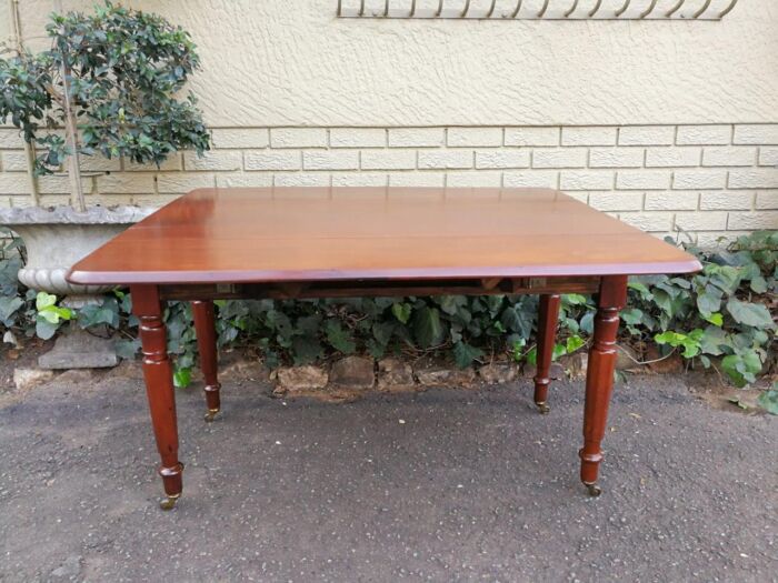 An Early 20th Century Mahogany Pembroke Table On Turned Legs