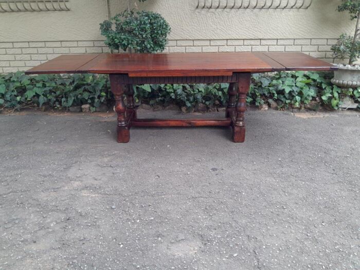 An Antique 19th Century Oak Refectory Table On Stretcher Base With Two Drawer Leaves