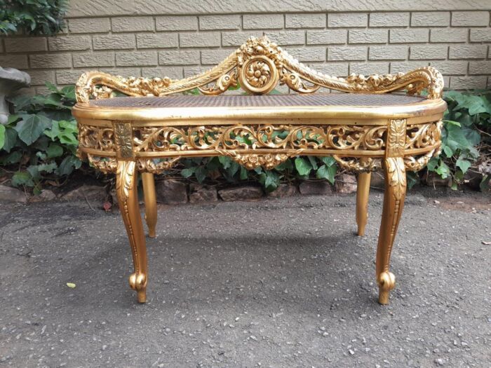 A 20th Century French Ornately Carved Giltwood And Rattan Window Seat