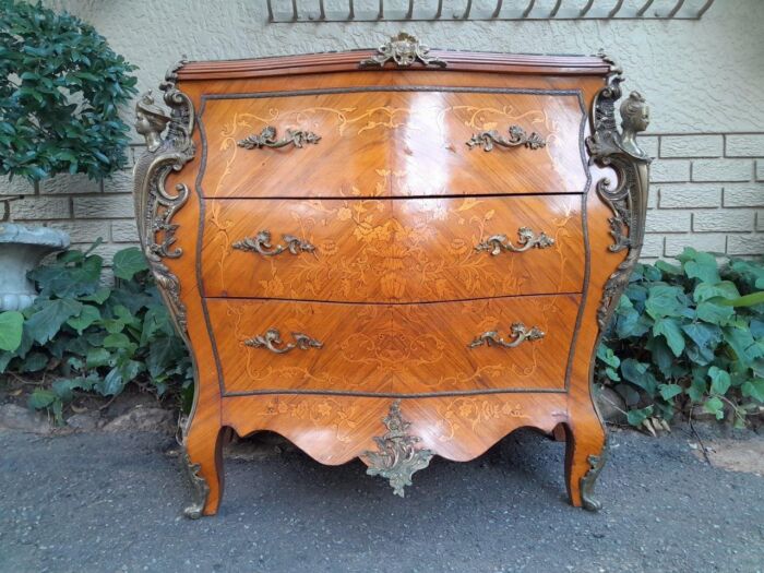 A 20th Century French Style Bombe Chest Of Drawers With Marble Top And Gilt Mounts