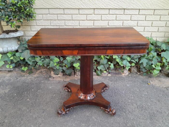 A Victorian rosewood swivel and tilt CARD TABLE