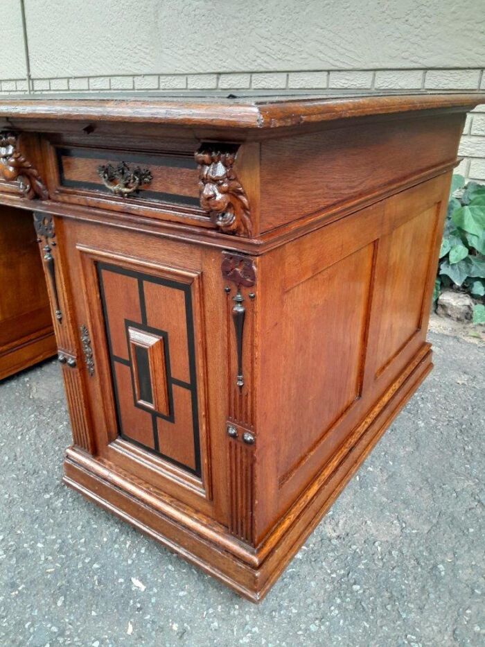 An Edwardian Circa 1910 Oak And Ebonised Desk With Gilt Tooled Green Leather Top Above Three Drawers Inside The Doors - Image 8