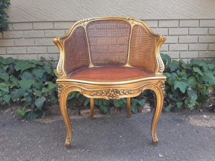 A 20TH Century French Style Gilded Rattan Bergère Chair