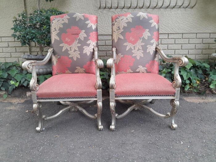 A 20TH Century French Louis XIV Style Carved And Hand Gilded Armchairs Upholstered In Leather