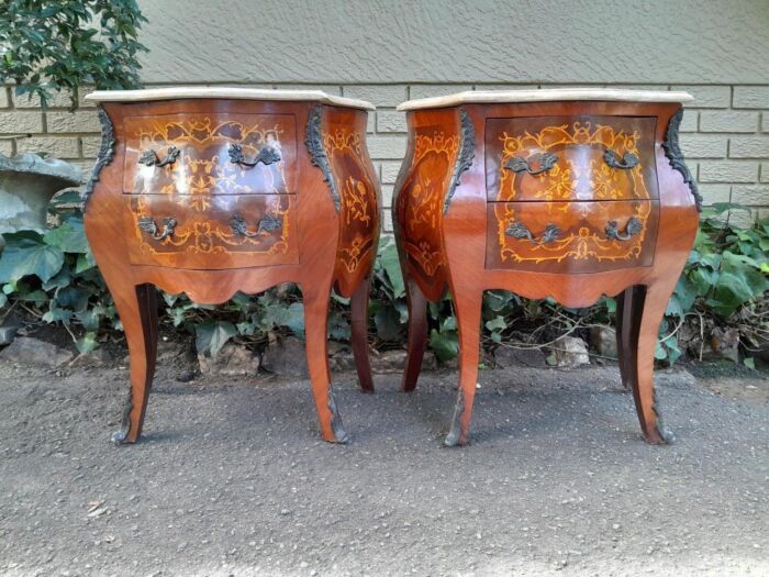 A 20th Century Pair of French Style Inlaid Mahogany Pedestals with Drawers and Marble Tops