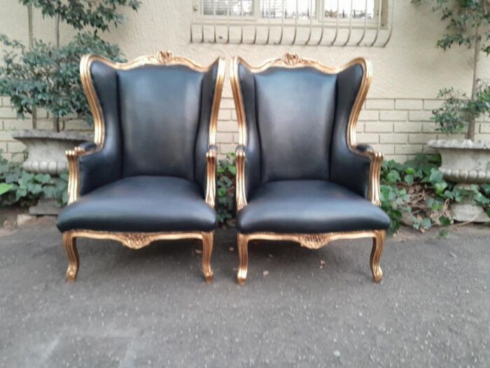 A Pair Of French Style Louis XVI Style Carved And Hand Gilded Wingback Chairs Upholstered In Leather - Image 2