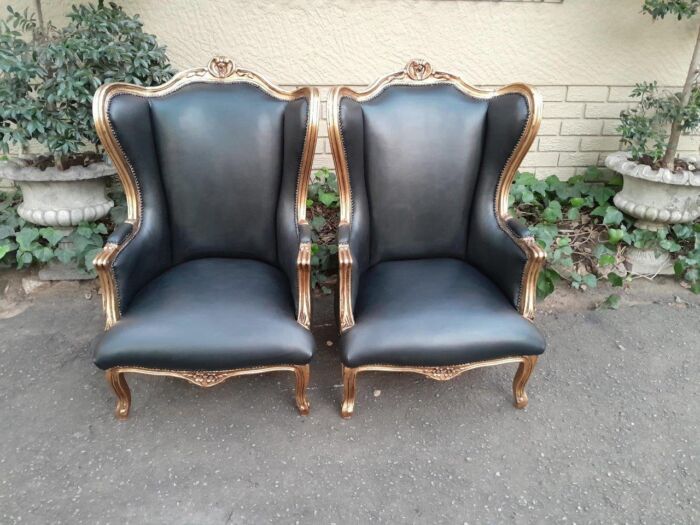 A Pair Of French Style Louis XVI Style Carved And Hand Gilded Wingback Chairs Upholstered In Leather - Image 3