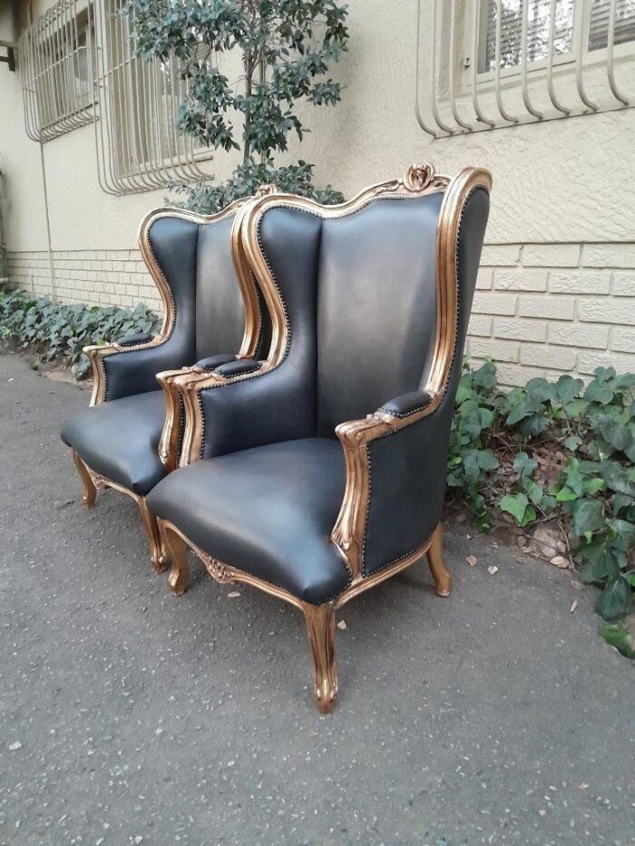 A Pair Of French Style Louis XVI Style Carved And Hand Gilded Wingback Chairs Upholstered In Leather - Image 4