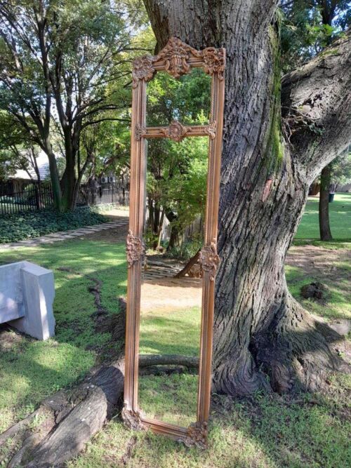 A French Style Ornately Carved And Bevelled Mirror In A Natural  /  Bleached Finish