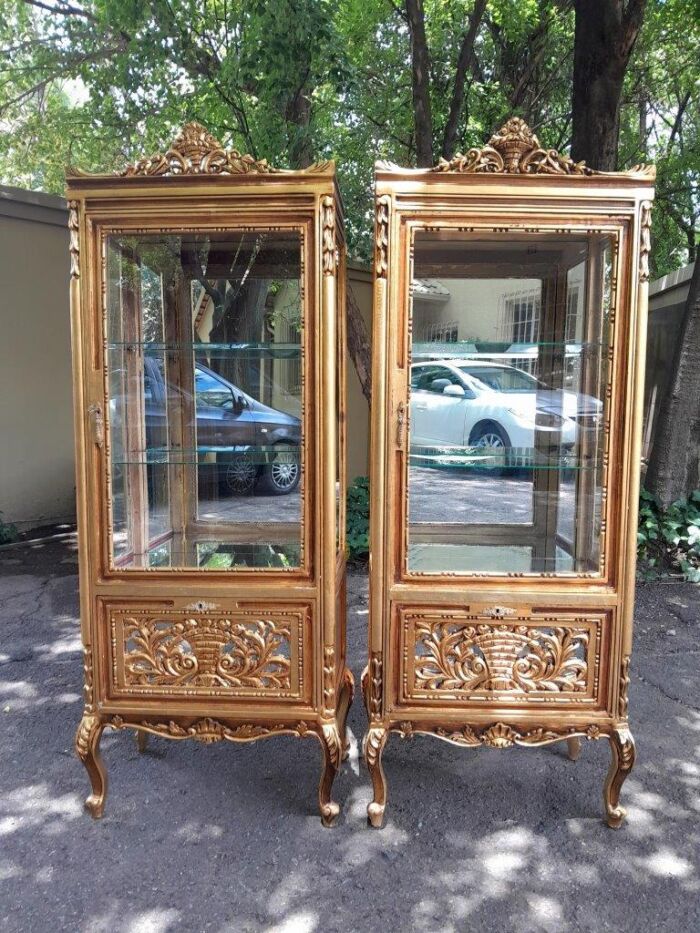 A Pair of French Louis XVI Style Ornately Carved & Gilded Showcases