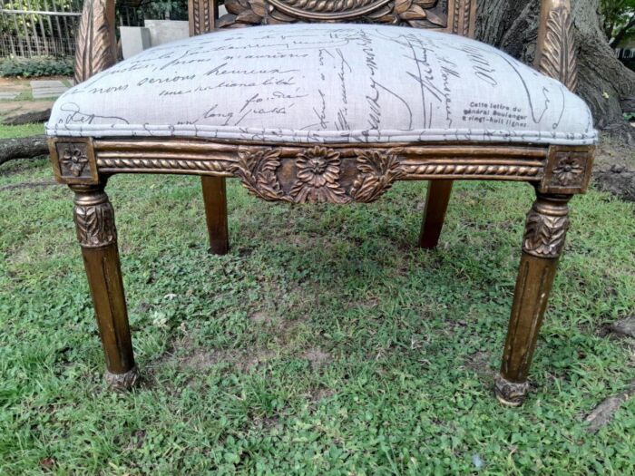 A 20TH Century French Style Pair of Ornately Carved and Gilded Armchairs Upholstered in a Custom-made Script Linen Fabric for The Crown Collection - Image 7