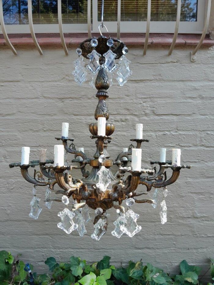 A 20th Century French Style Antique Brass and Crystal Twelve Light Chandelier - Image 2