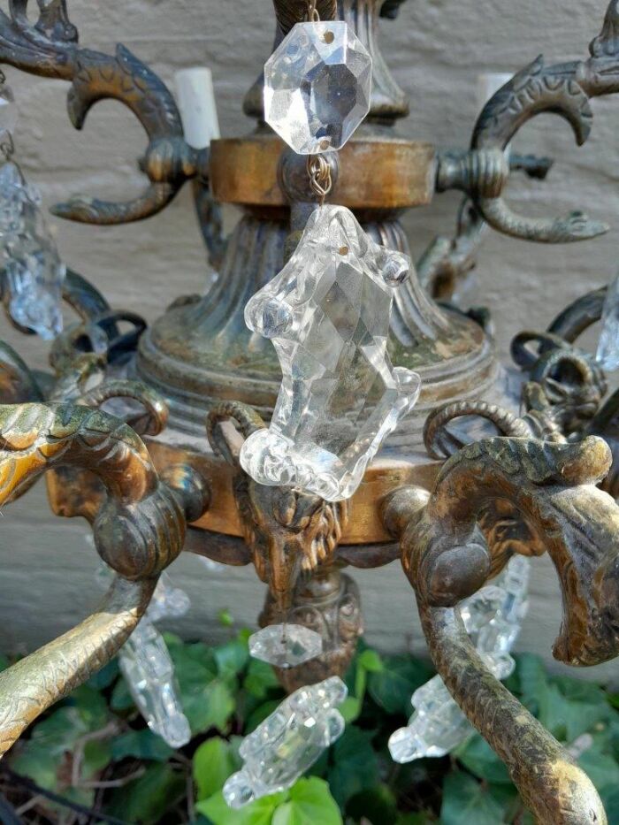 A 20th Century French Style Antique Brass and Crystal Twelve Light Chandelier - Image 9